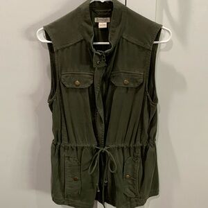Army green zip up vest. Drawstring